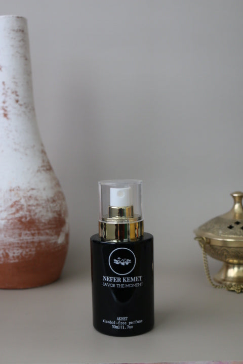 50 ml black perfume bottle around a vase and incense burner for refills
