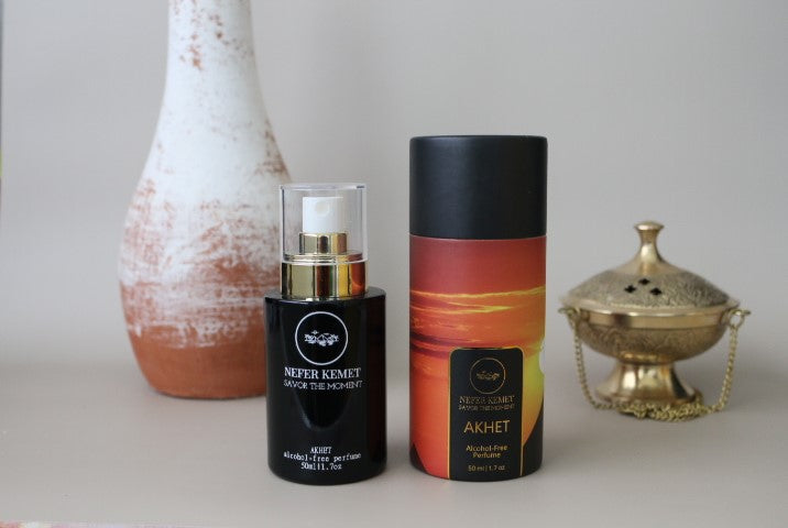 50 ml black perfume bottle around a vase and incense burner with the sunrise packaging